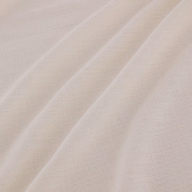 Pale mallow-beige fine weave falling in soft diagonal folds