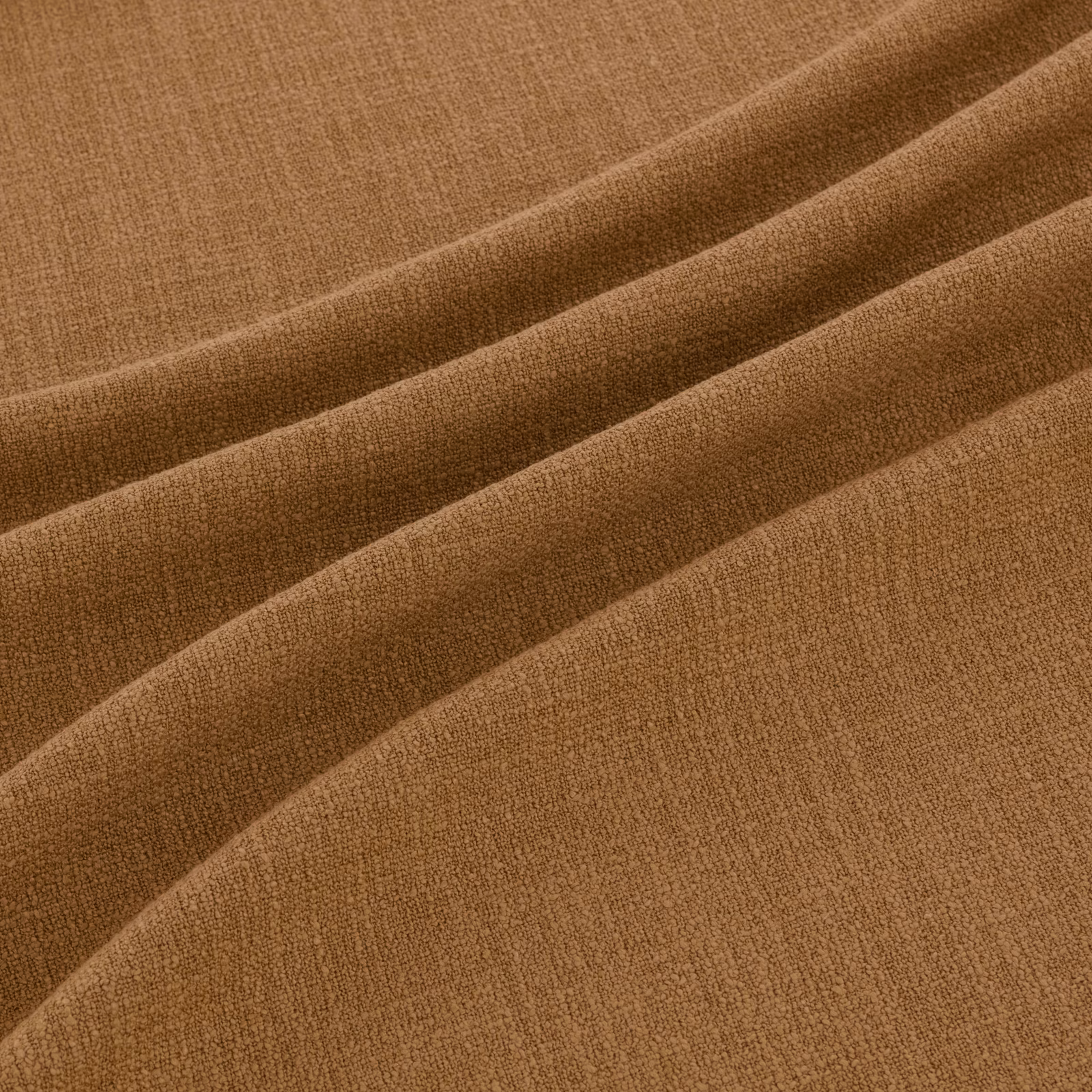 Warm ochre-brown woven fabric showing fine texture and softly shaded folds