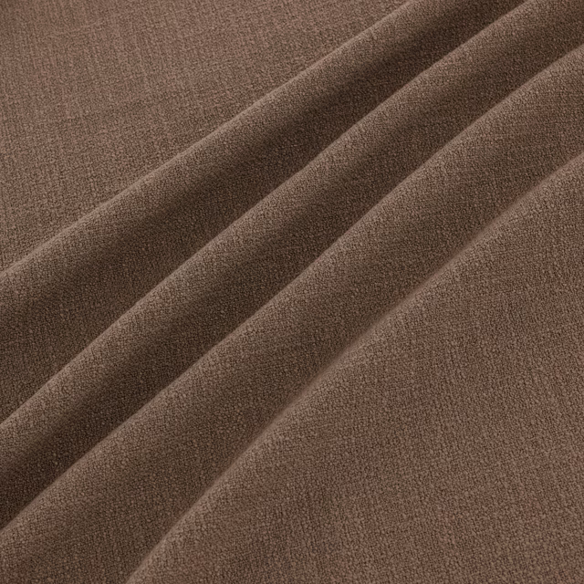 Warm praline-brown woven fabric with fine grain and soft diagonal folds