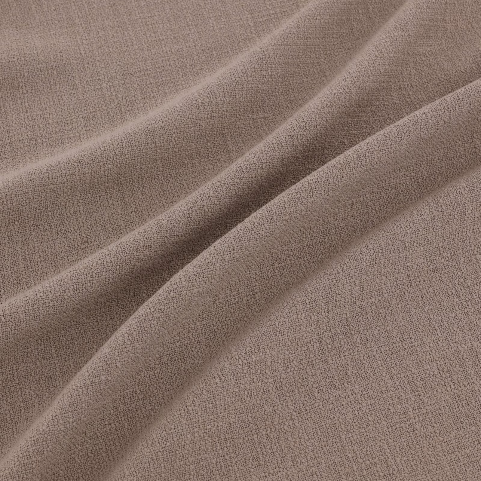 Muted taupe-grey woven fabric draped in soft folds with a fine pebbled texture