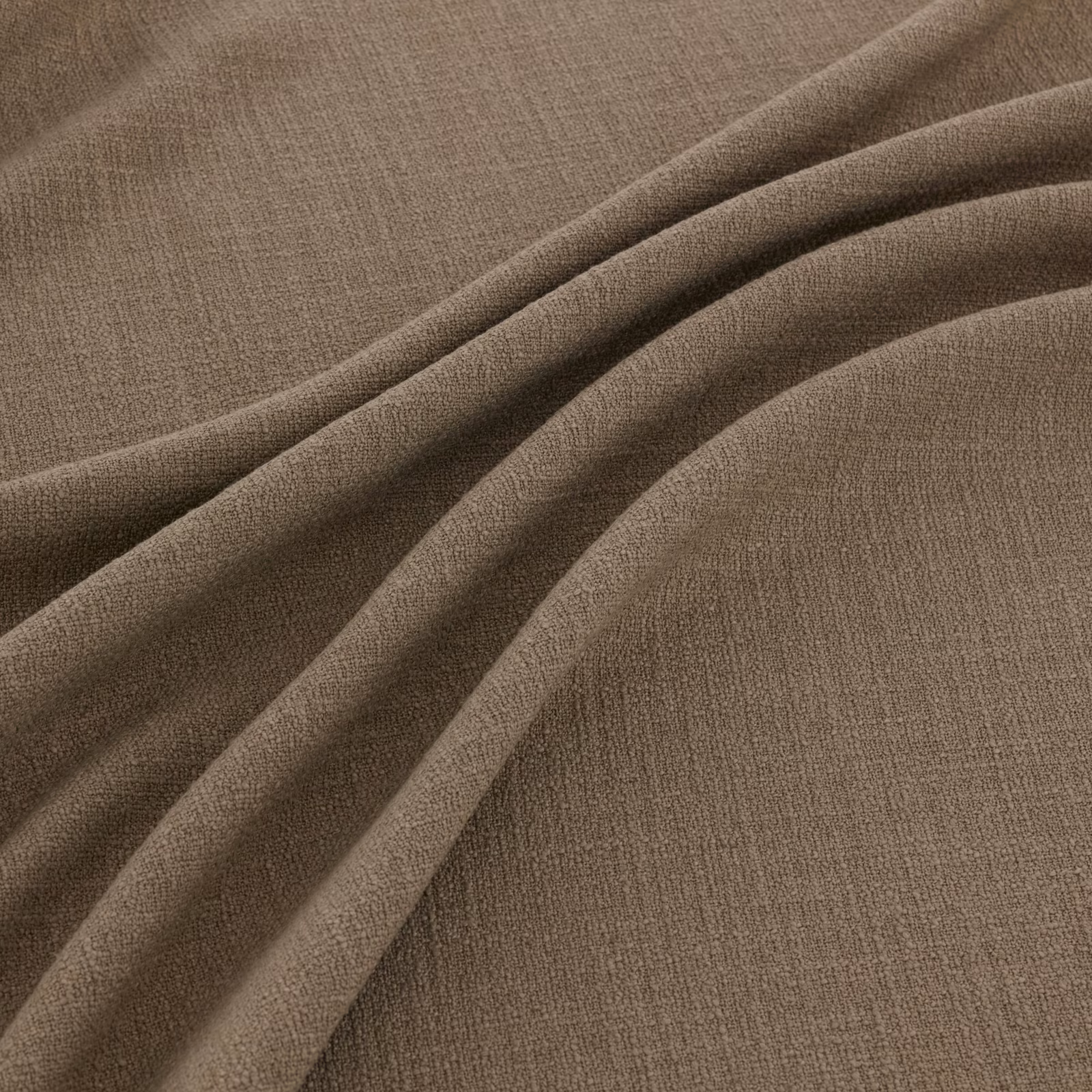 Muted taupe-brown woven fabric folded to show fine texture and soft fluid drape