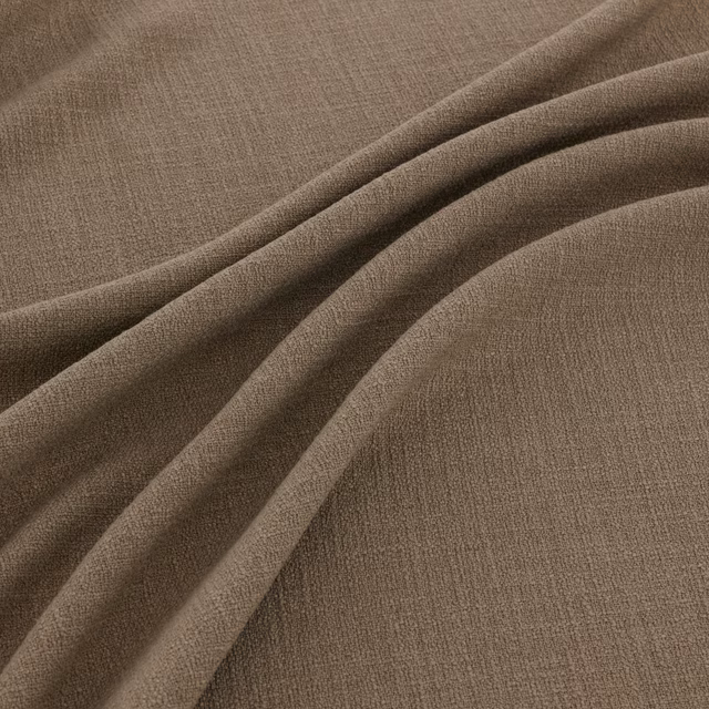 Muted taupe-brown woven fabric folded to show fine texture and soft fluid drape