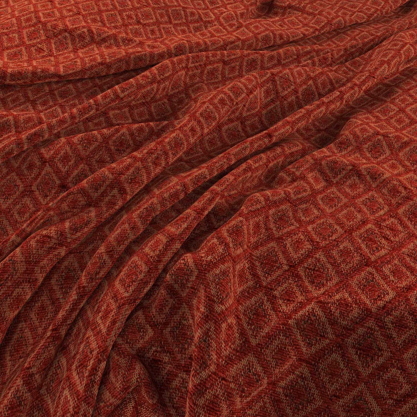 Deep brick-red woven fabric with small geometric diamonds and softly folded texture