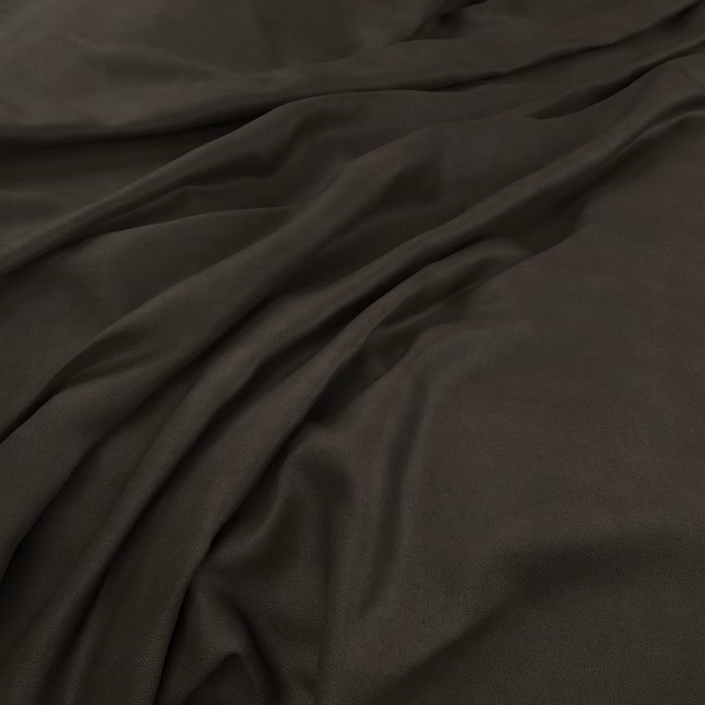 Deep slate-grey fabric draped in broad folds with a restrained satin sheen