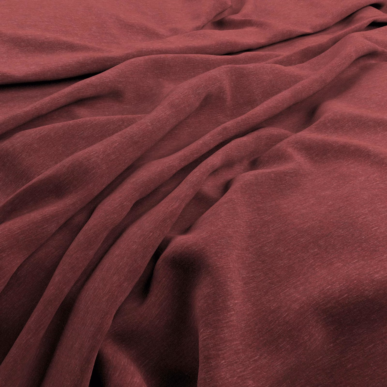 Deep firebrick velvet with soft pile, folded drape and low directional sheen