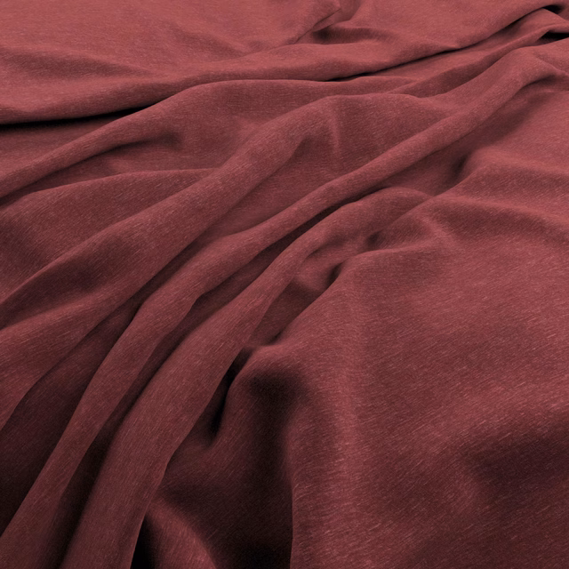 Deep firebrick velvet with soft pile, folded drape and low directional sheen