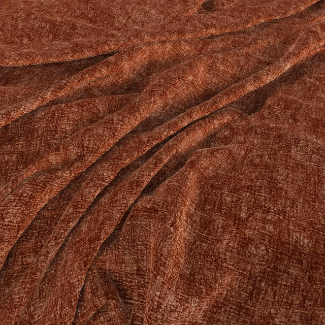 Warm henna-rust fabric draped in folds with a softly reflective crosshatched texture