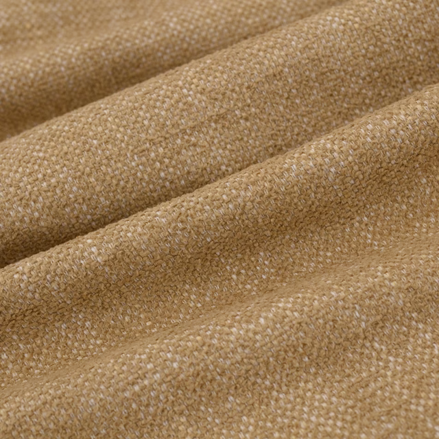 Warm dune-beige woven textile showing chunky texture and softly flecked tonal variation