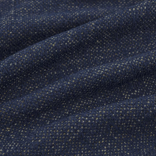 Deep indigo woven texture with muted olive flecks and folded ridges