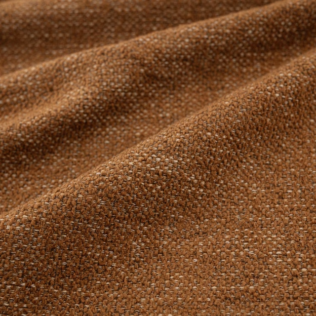 Warm kiln-brown chunky weave with flecked yarn texture in close-up