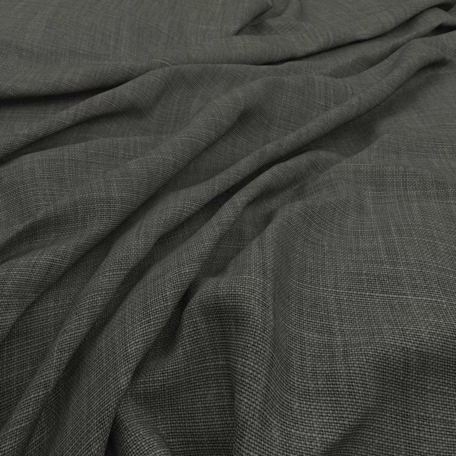 Deep pine-green fine weave with charcoal shading across soft fabric folds