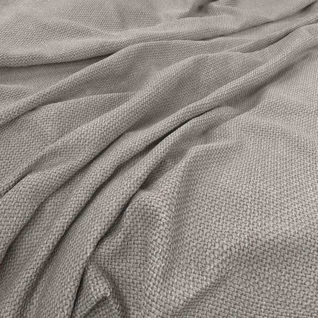 Soft cloud-grey woven textile with fine pebbled texture arranged in loose folds