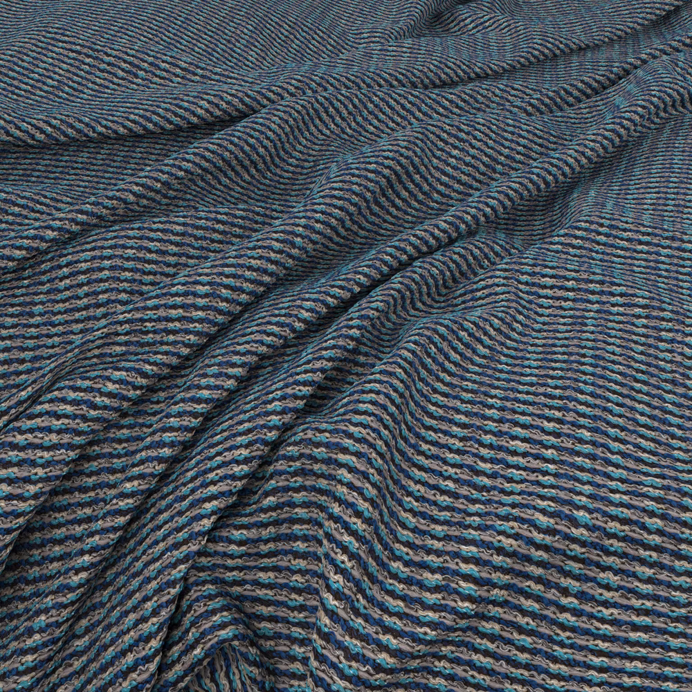 Close view of dark blue-teal Waffle Marina with rippled charcoal-striped texture
