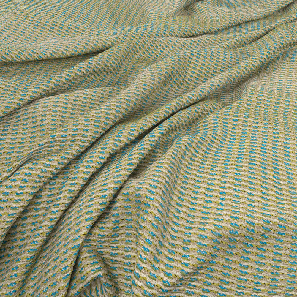 Sandy beige waffle weave with turquoise flecks and softly folded texture