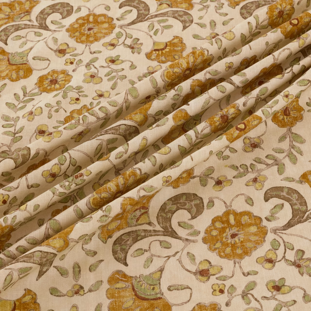 Cream fabric with amber flowers, olive foliage and brown paisley motifs