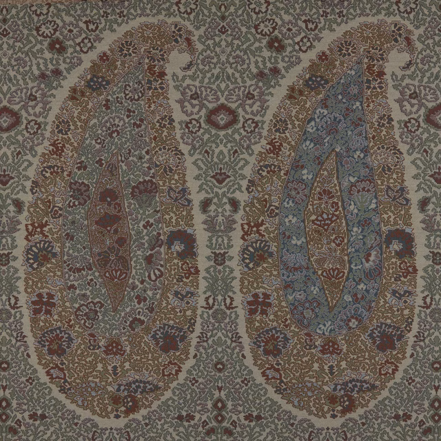 Muted sage-grey paisley fabric with oversized blue, russet and brown floral motifs
