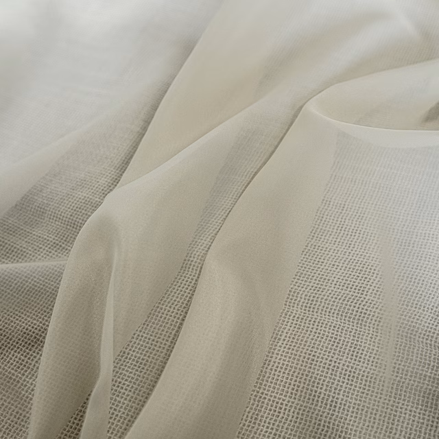Warm ivory Whisper fabric with fine open gauze weave in soft folds