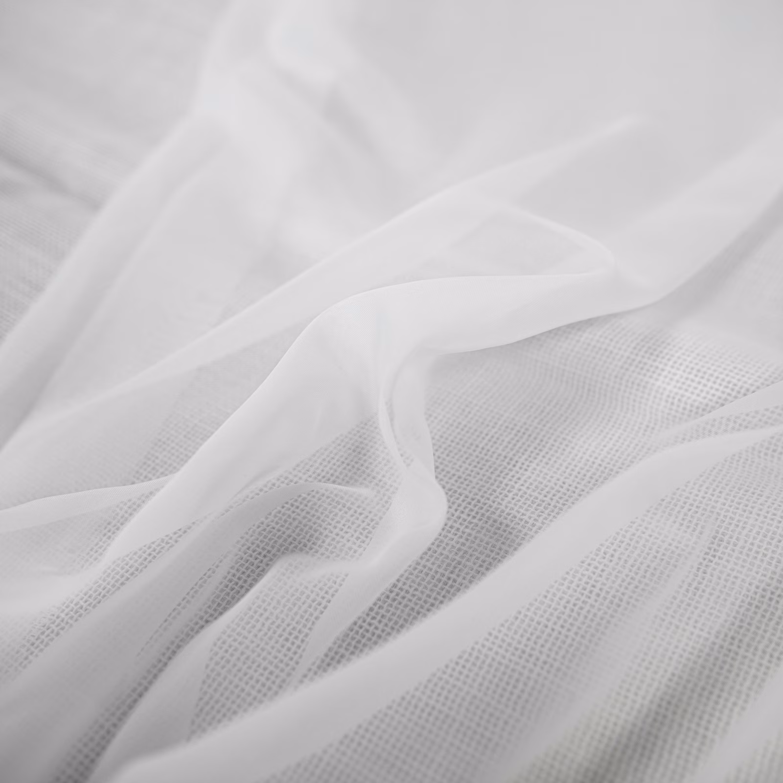 Soft white sheer mesh with translucent folds and a fine grid weave