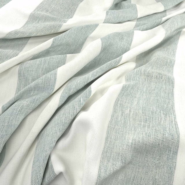 Pale blue-grey and ivory broad striped fabric gathered into soft textured folds