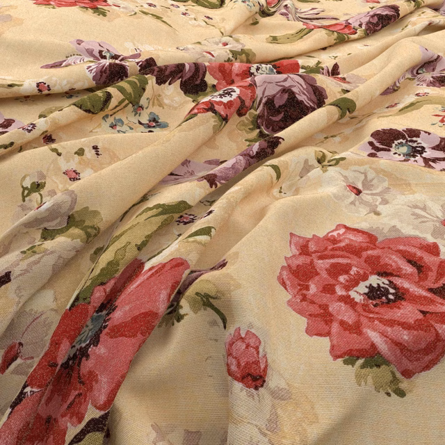 Antique cream floral fabric with red blooms, plum flowers and olive leaves in soft folds.