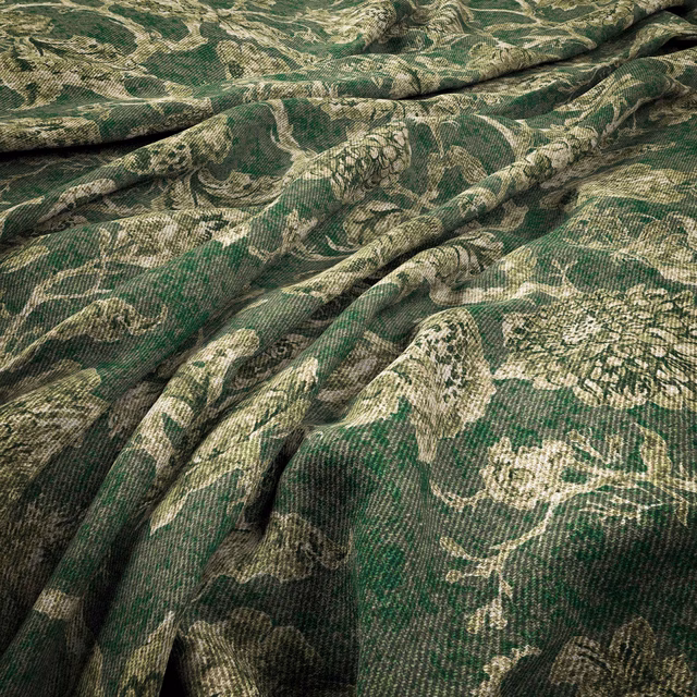 Deep spruce green woven fabric with pale olive botanical forms and rippled texture