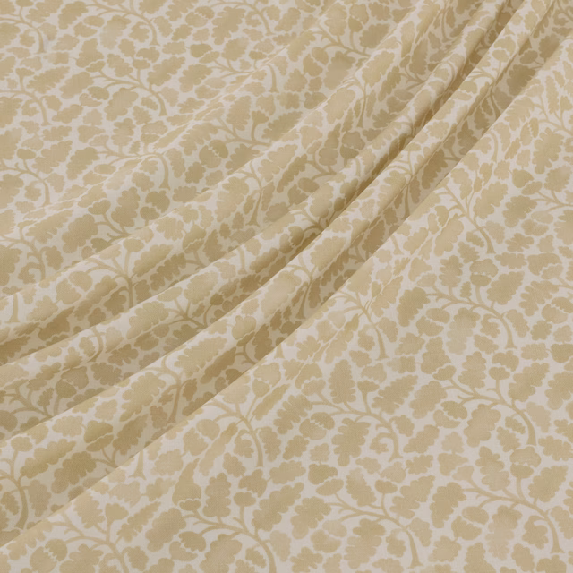 Warm oyster and cream floral damask with scrolling motifs gathered into soft folds