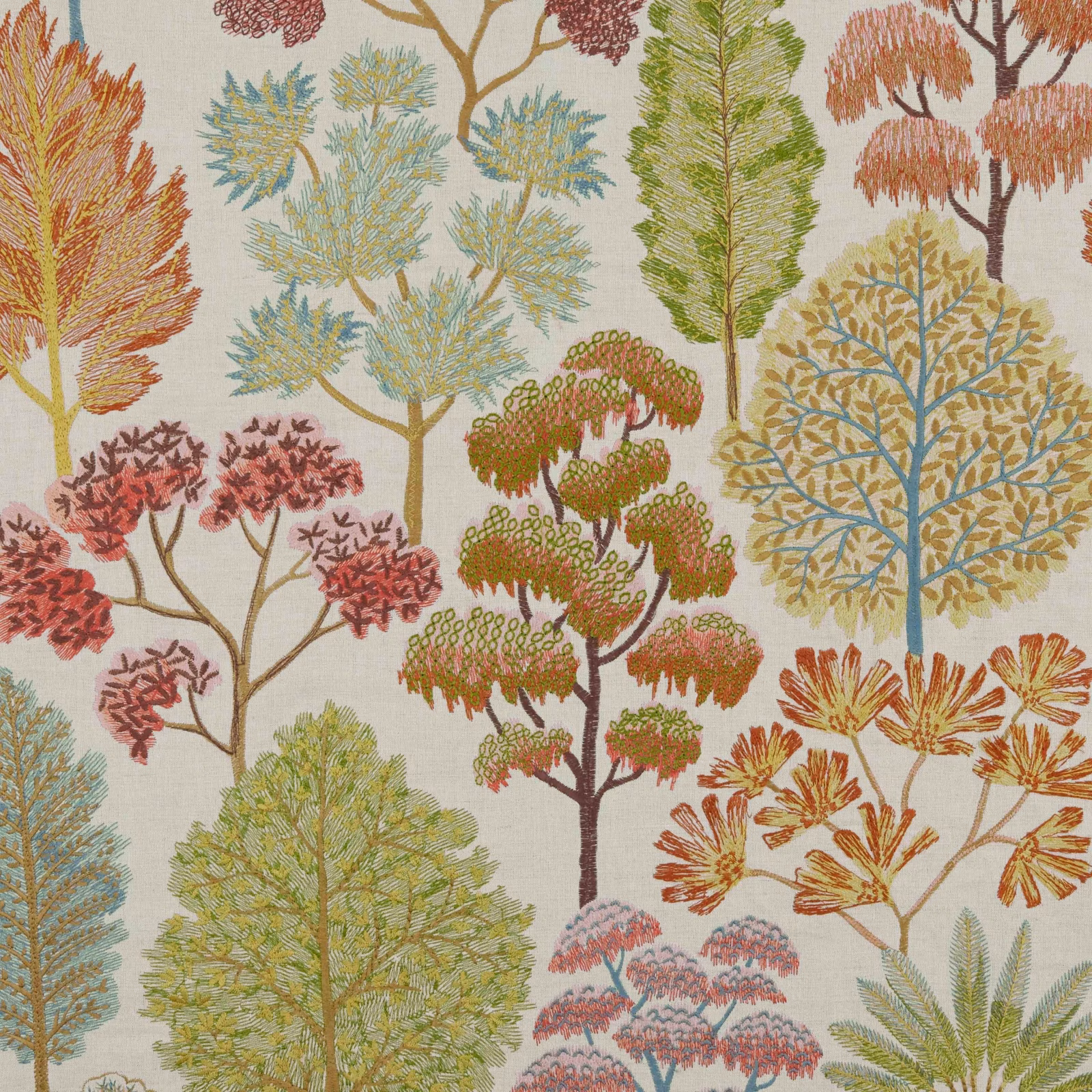 Warm ivory fabric with rust, teal and olive woodland trees in a detailed botanical pattern