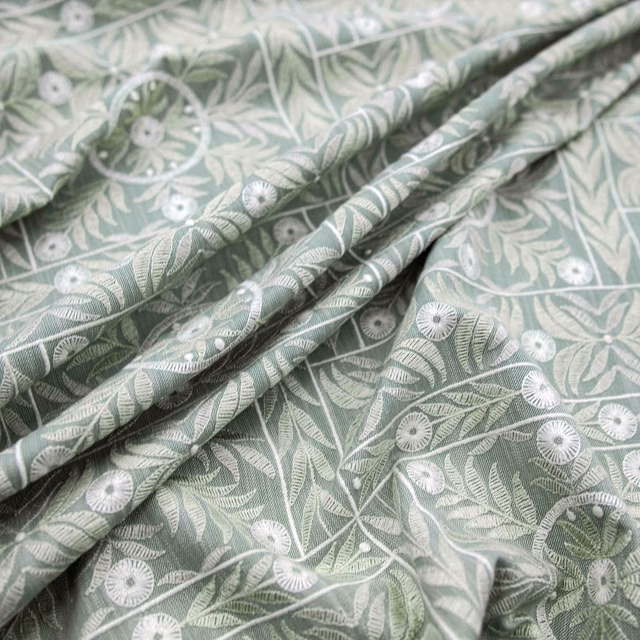 Pale eau de nil fabric with white daisies and leafy winding stems