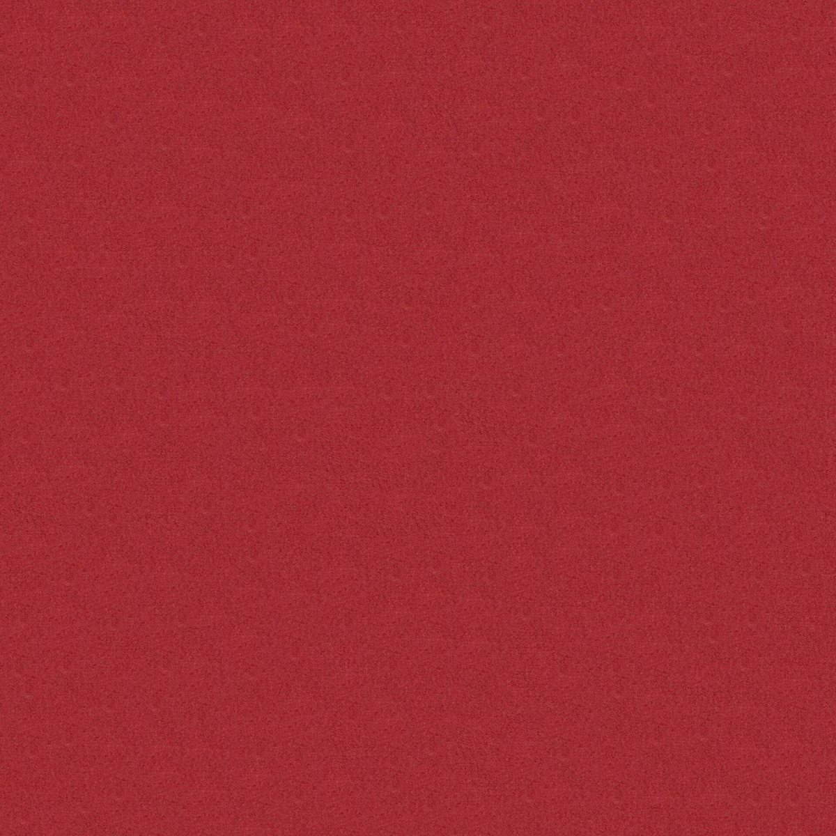 Close-up of rich red rose fabric with a softly mottled, matte texture