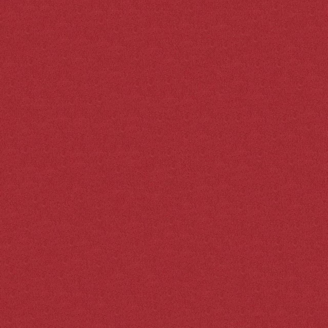 Close-up of rich red rose fabric with a softly mottled, matte texture