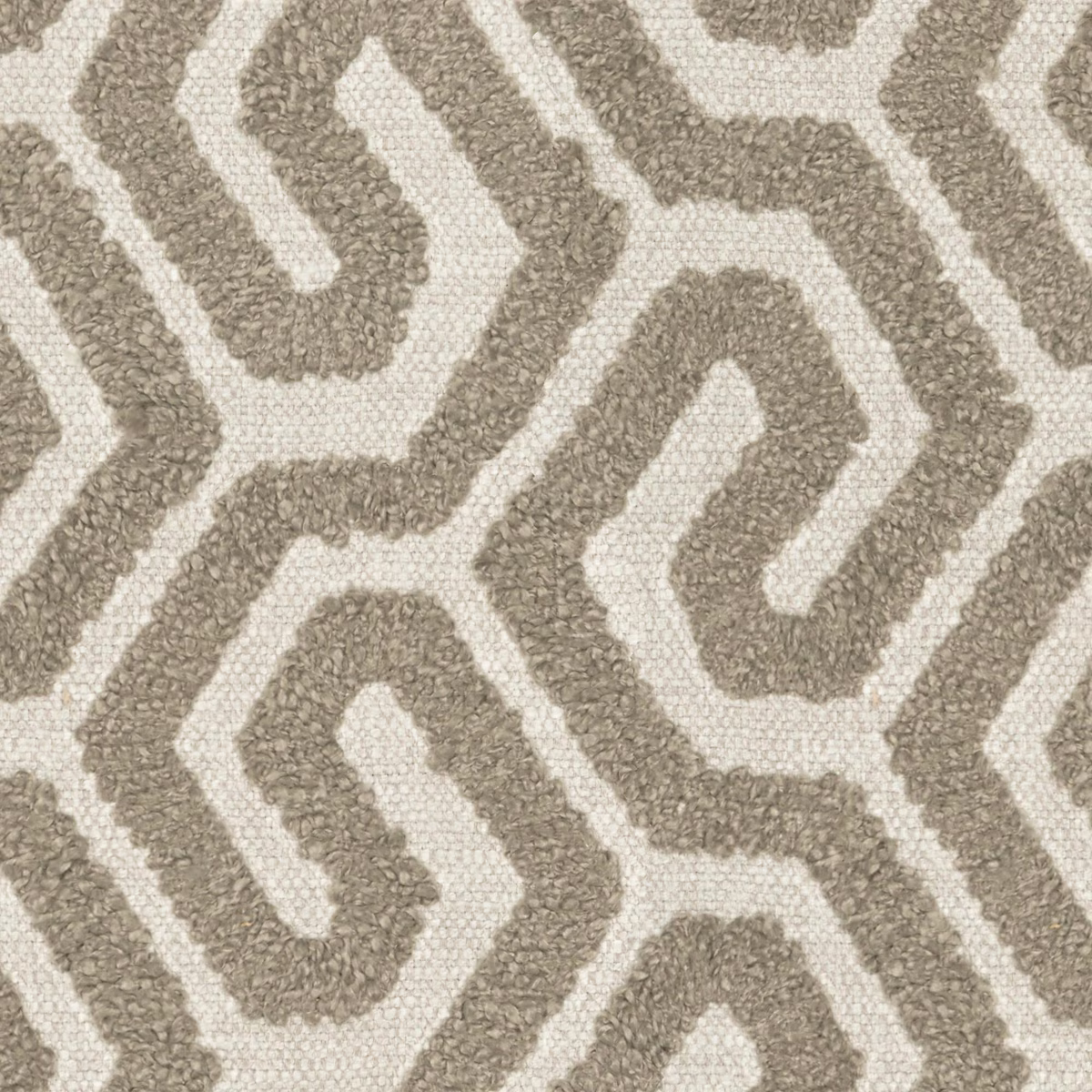Nubby warm taupe geometric meanders woven over an ivory ground