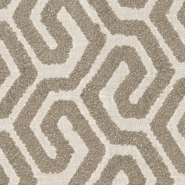 Nubby warm taupe geometric meanders woven over an ivory ground