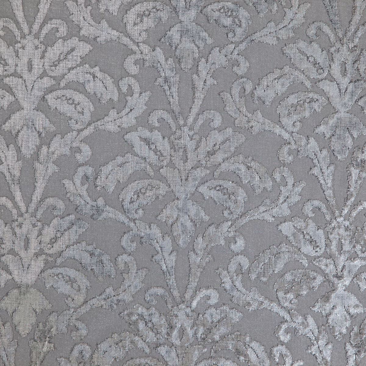 Cool grey damask fabric with raised silver foliage and scrolling leaves