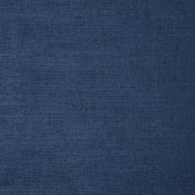 Deep indigo woven swatch with fine horizontal slub and softly mottled texture