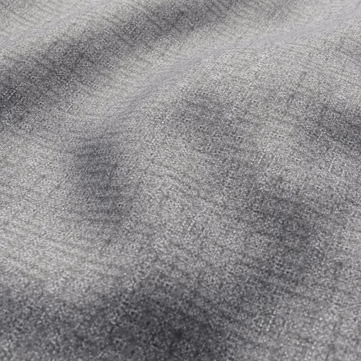 Close-up of cool grey fabric with fine weave and softly mottled charcoal shading
