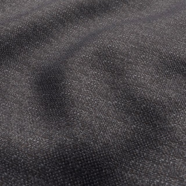 Close-up of dark cocoa-brown woven textile with charcoal threads and softly ridged texture