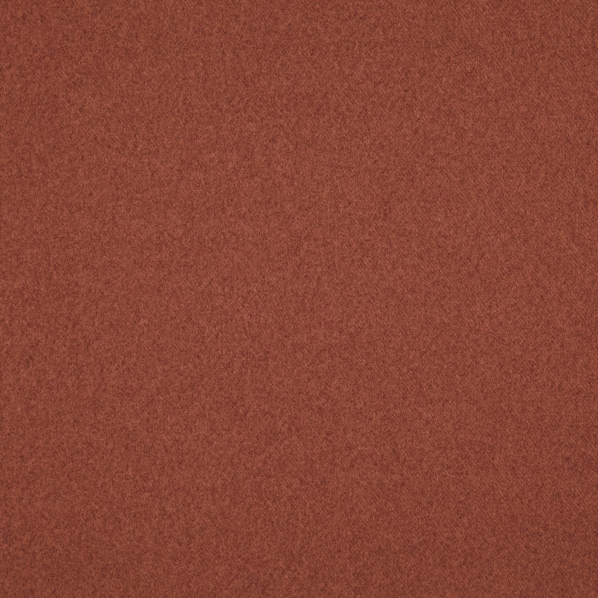 Russet terracotta Brodie fabric showing a soft, fine-grain textured surface