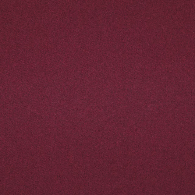 Deep cranberry textile with subtle tonal mottling and a soft matte surface