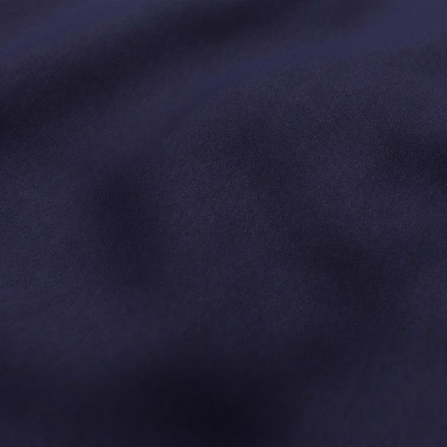 Deep ink-blue textile with a softly lustrous, close-textured surface
