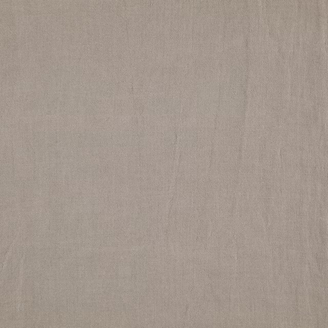 Close view of cool zinc-grey plain weave with fine vertical slubs and soft texture