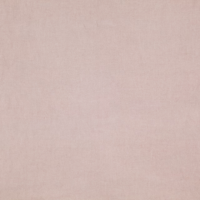 Close-up of pale blush-pink Cairn fabric with a fine, even woven texture