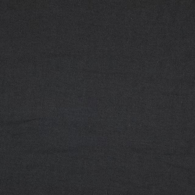 Near-black charcoal Cairn textile with a fine, subtly mottled woven surface