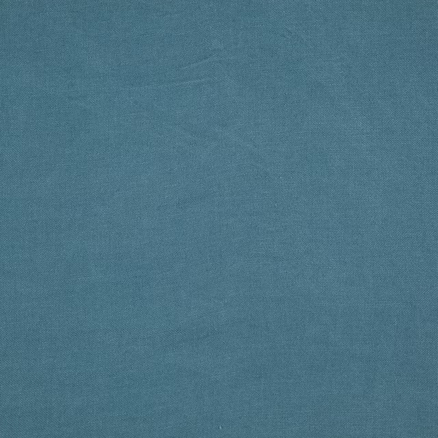 Muted blue-teal plain weave with fine tonal texture across the Cairn swatch