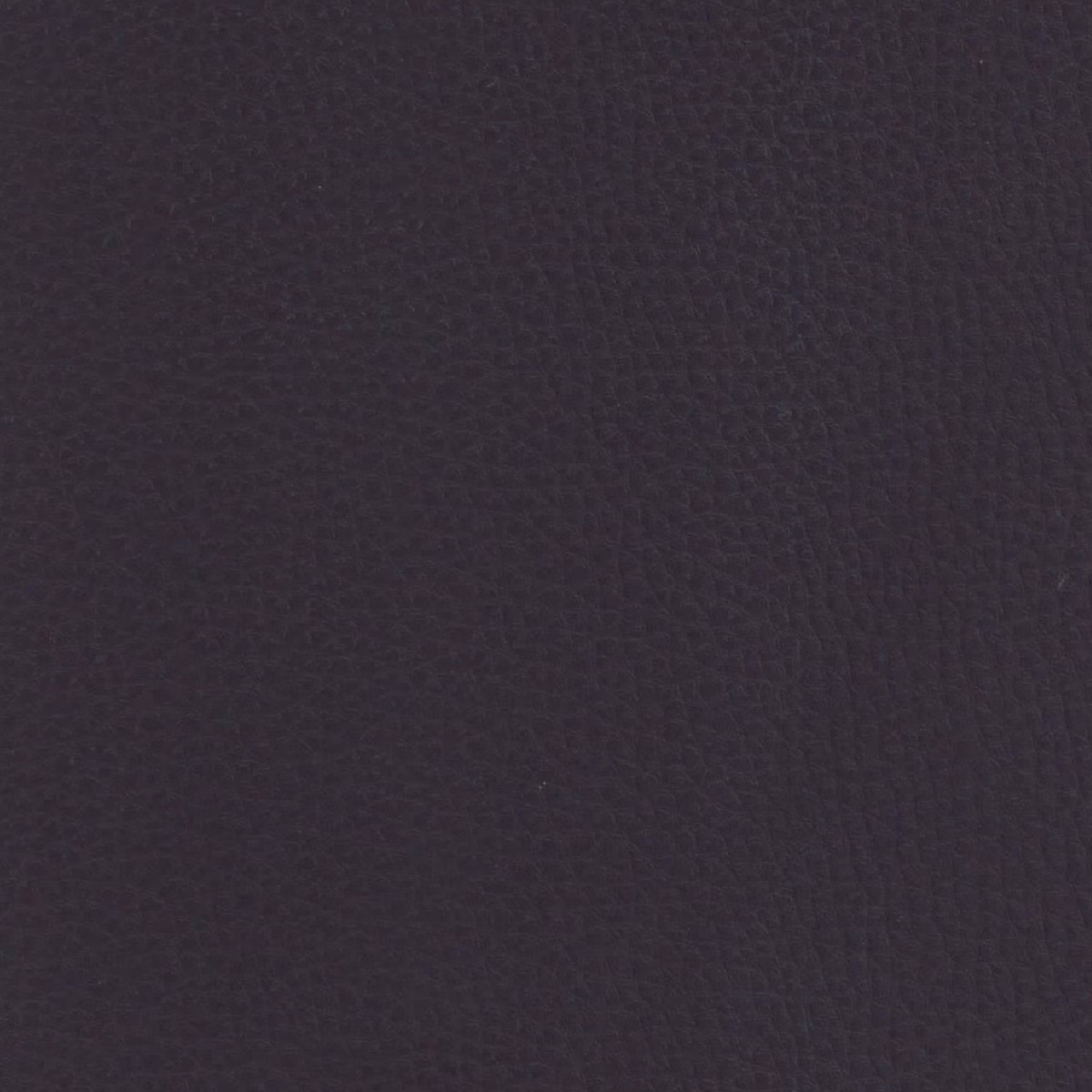 Dark aubergine-purple fabric with a subtle close-grained, lightly pebbled texture