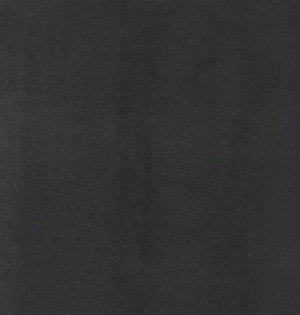 Near-black charcoal textile with a cool lavender cast and subtly mottled surface