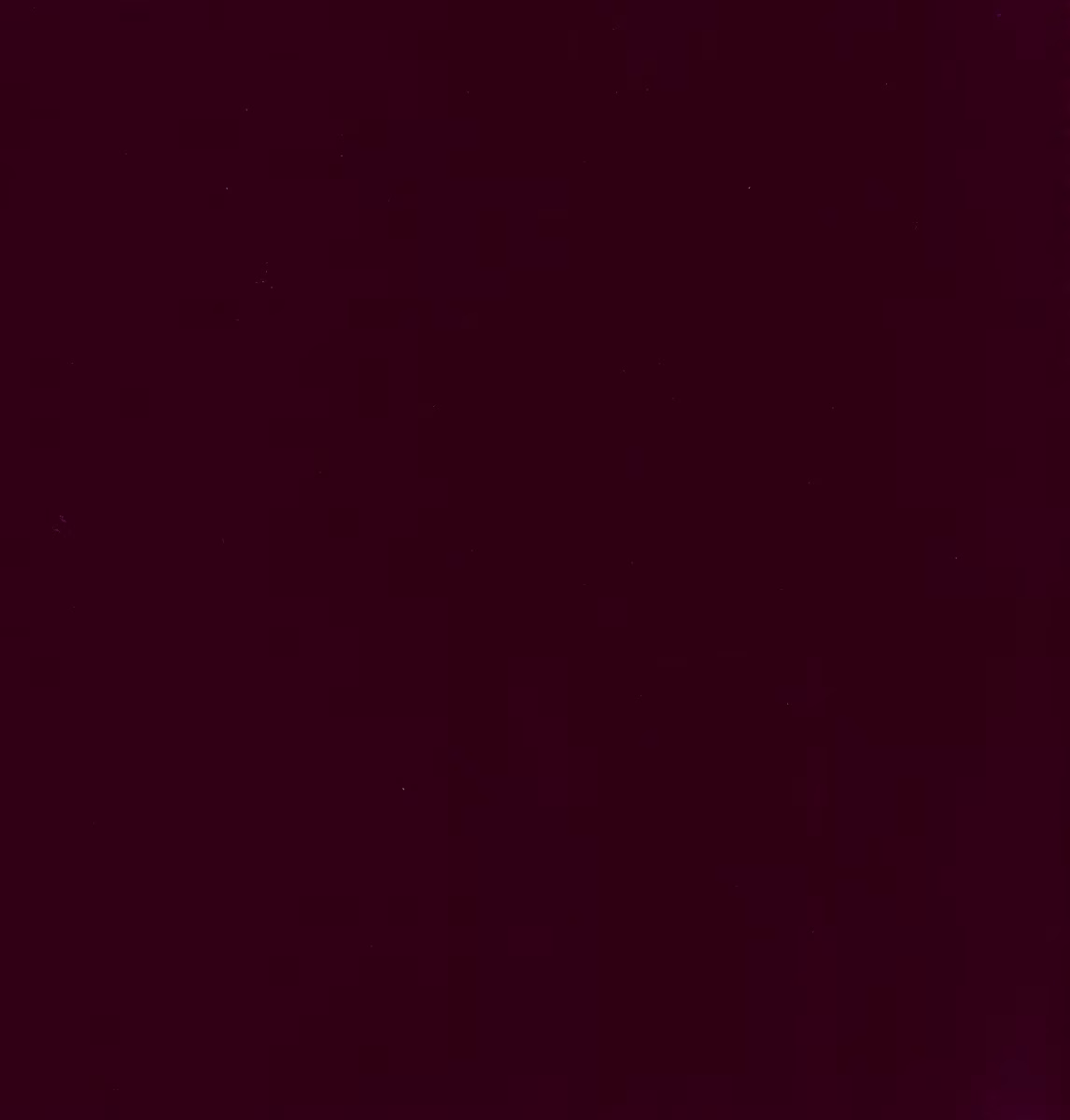 Deep cherry-burgundy plain fabric with subtle tonal variation across its dense surface