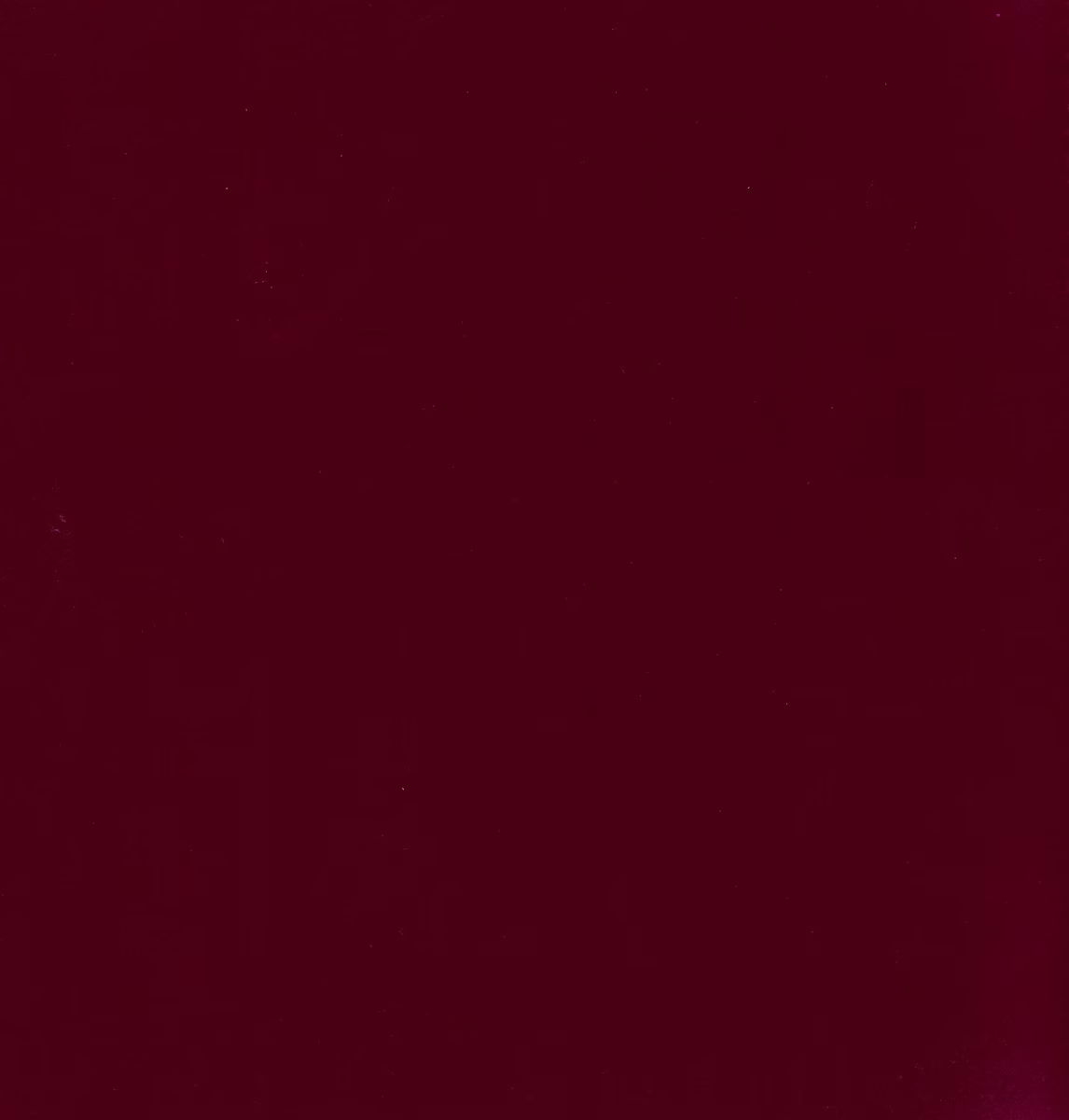 Deep ruby-red fabric with subtle tonal shading across a dense, even surface