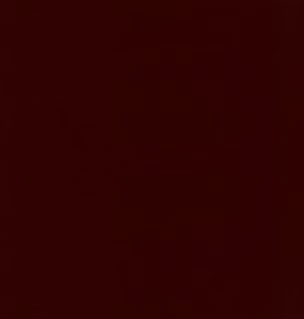 Deep oxblood-red fabric swatch with a shadowed, subtly textured surface