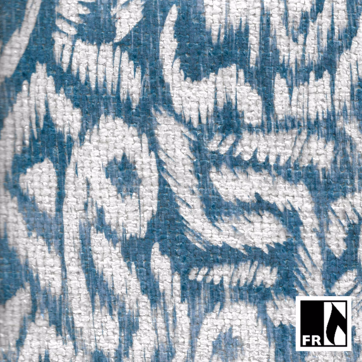 Muted denim-blue woven fabric with chalky ivory abstract markings and raised texture
