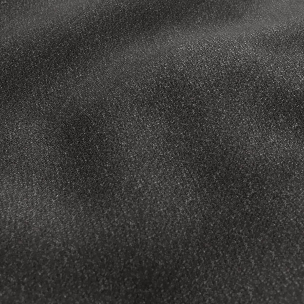 Close-up of deep graphite fabric with dense, softly mottled tactile texture